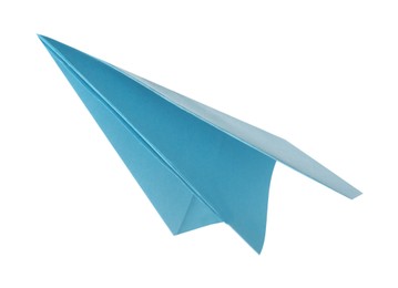 Photo of One handmade light blue paper plane isolated on white