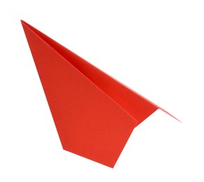 Photo of One handmade coral paper plane isolated on white