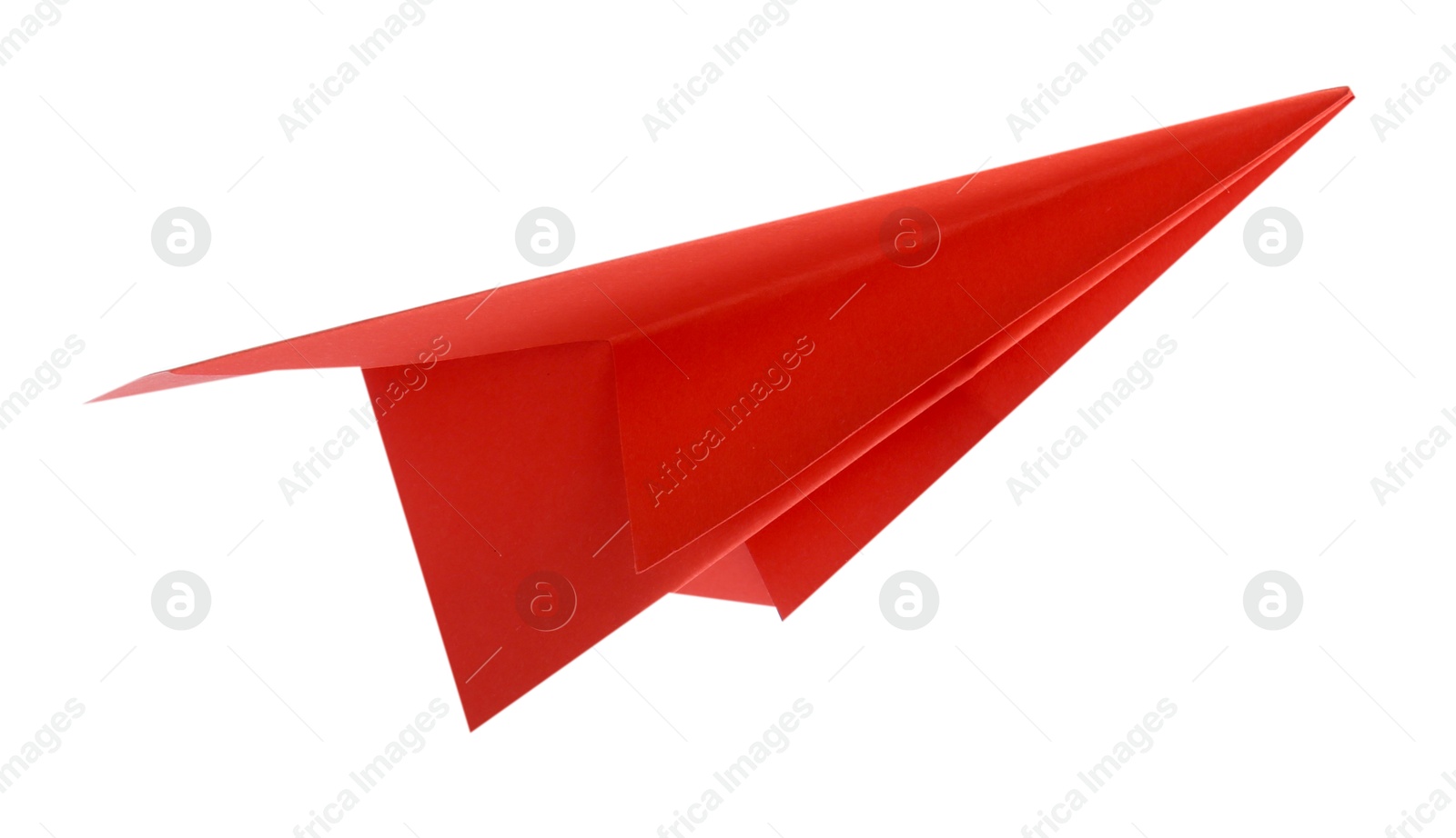 Photo of One handmade coral paper plane isolated on white