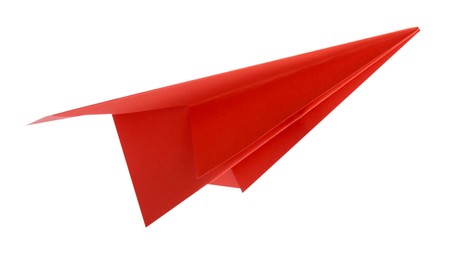 Photo of One handmade coral paper plane isolated on white