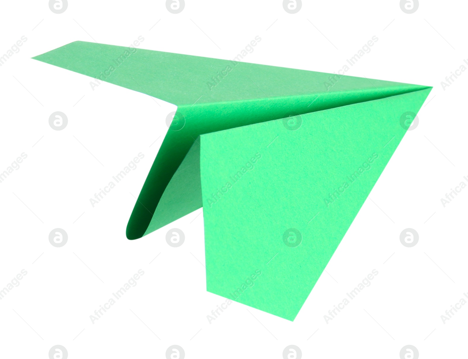 Photo of One handmade green paper plane isolated on white