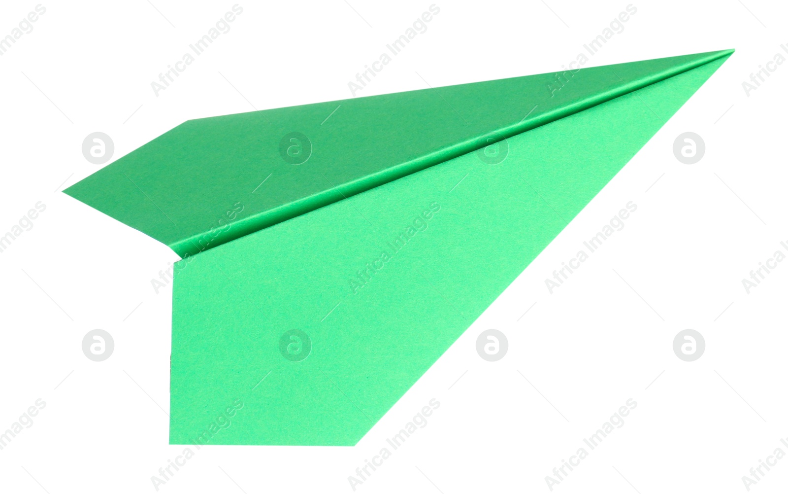 Photo of One handmade green paper plane isolated on white