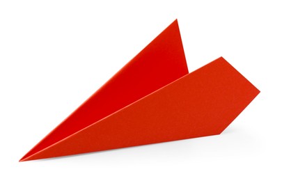 One handmade coral paper plane isolated on white