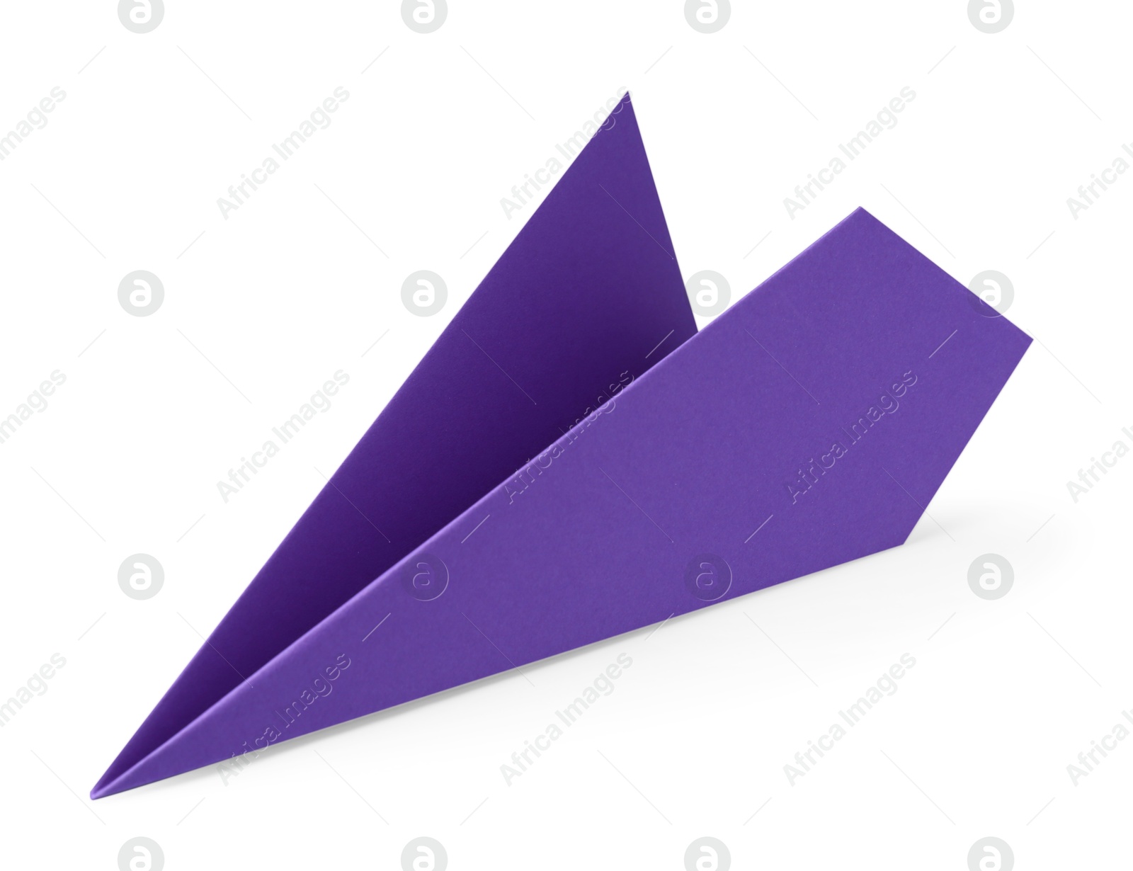 Photo of One handmade purple paper plane isolated on white