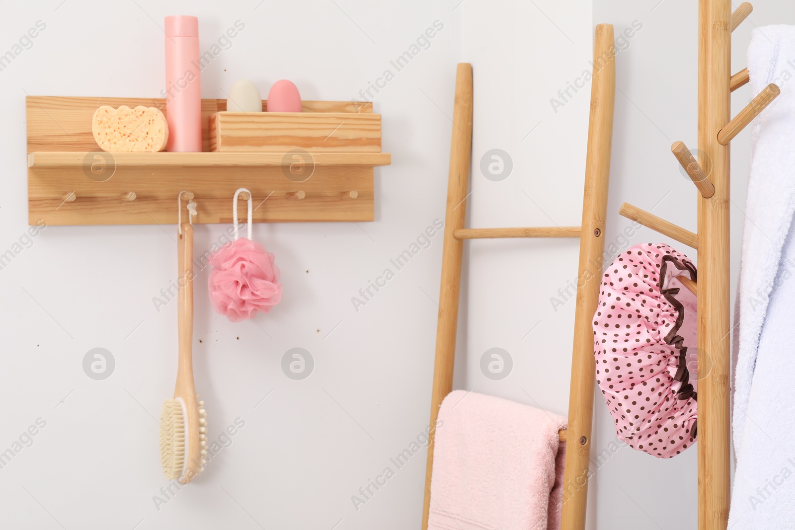 Photo of Shower cap and bath accessories in bathroom