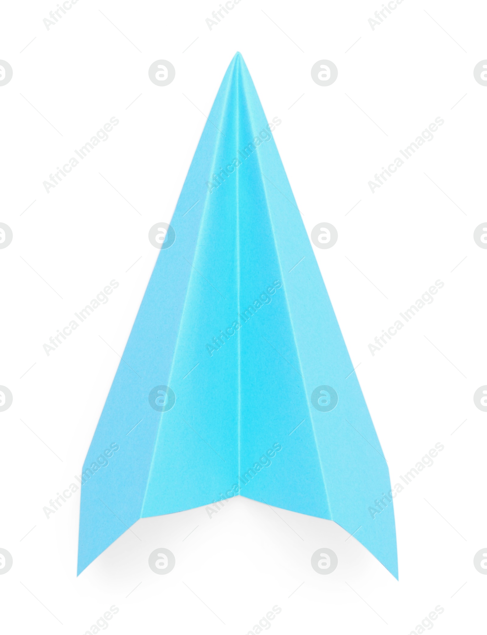 Photo of One handmade light blue paper plane isolated on white, top view