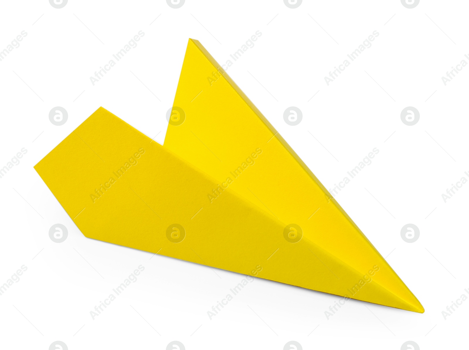 Photo of One handmade yellow paper plane isolated on white