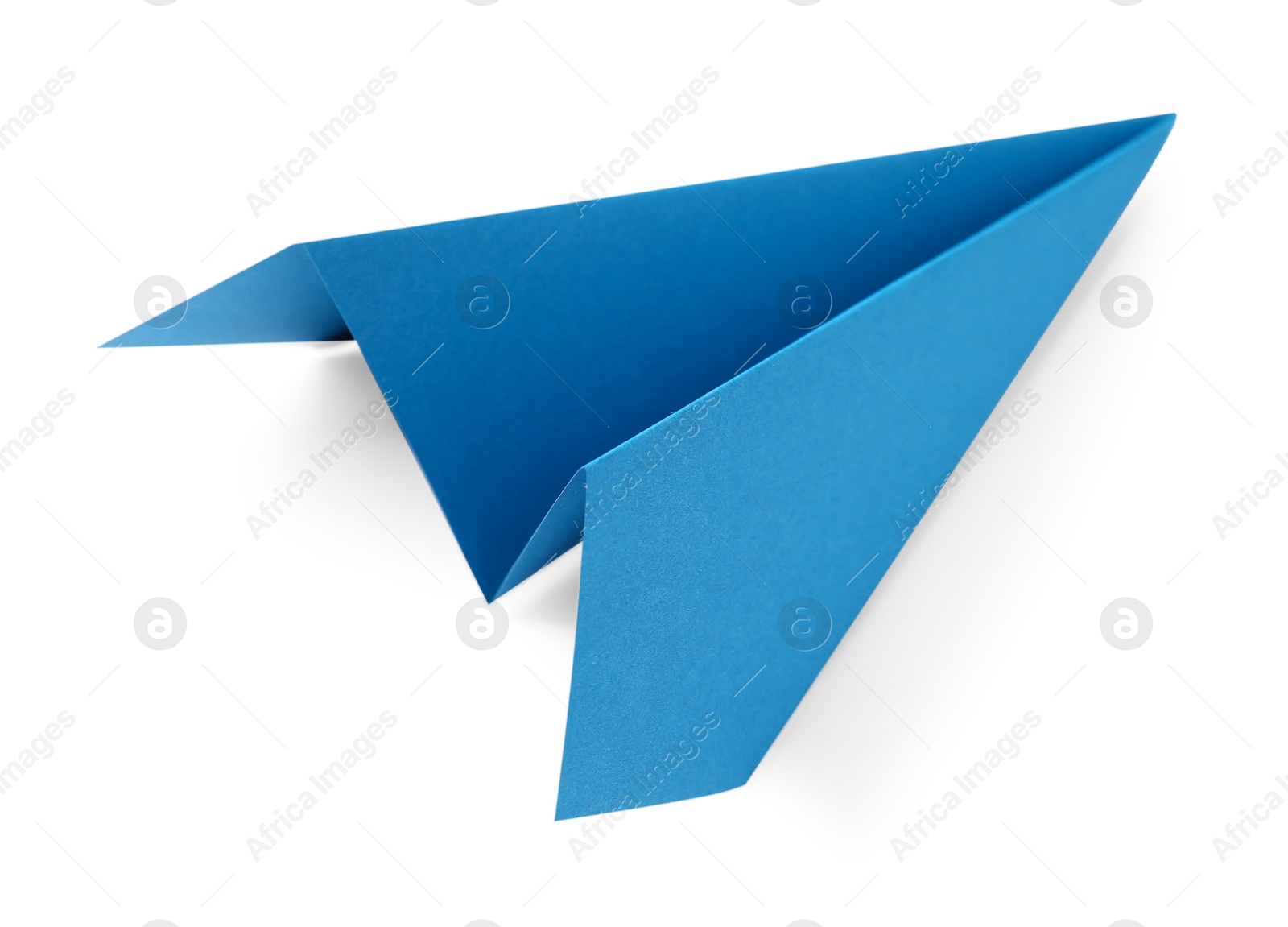 Photo of One handmade light blue paper plane isolated on white