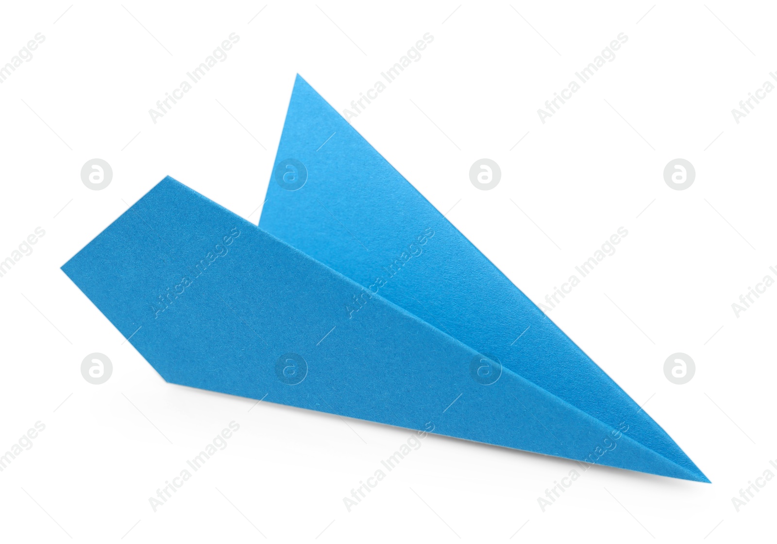 Photo of One handmade light blue paper plane isolated on white