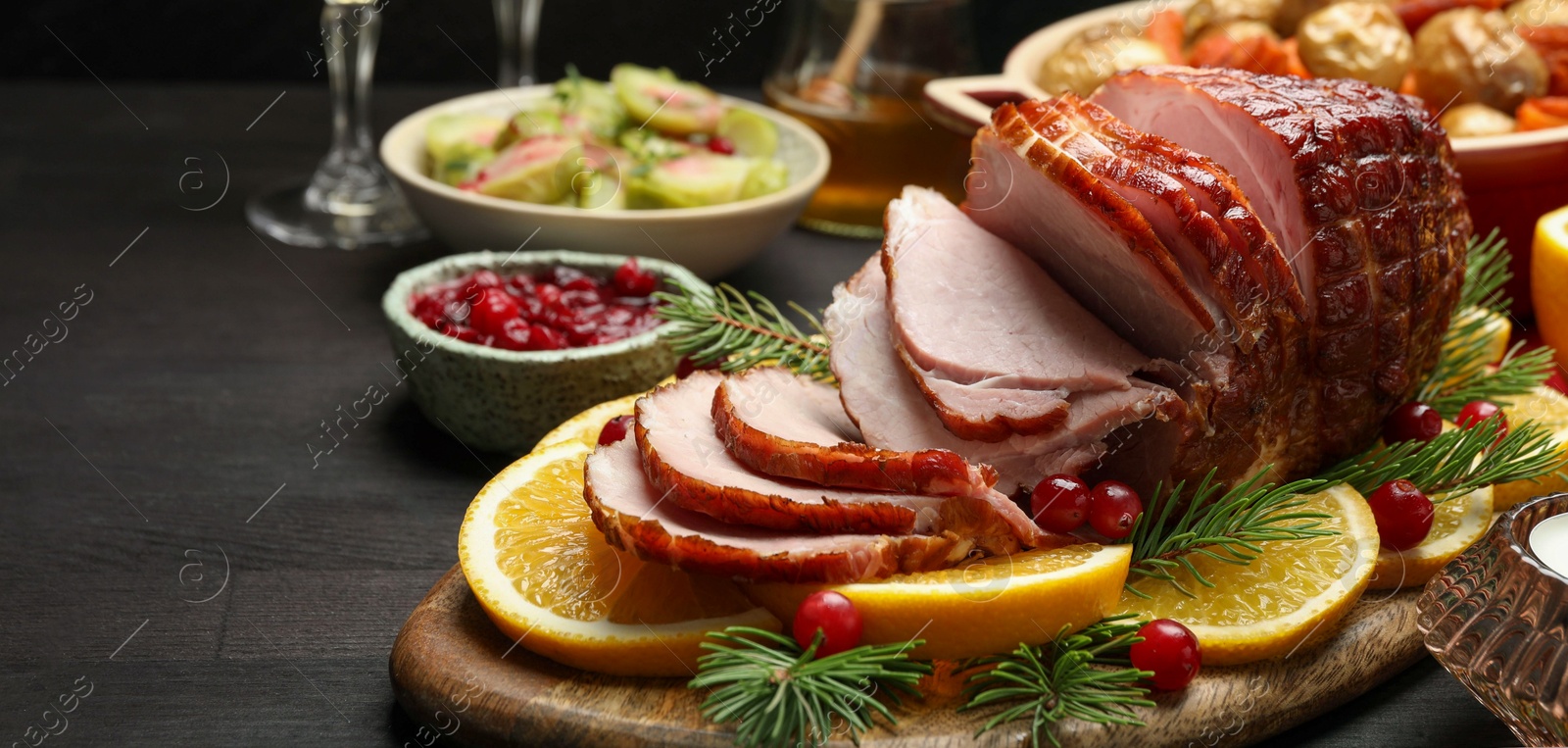 Photo of Tasty baked ham served on black wooden table, closeup