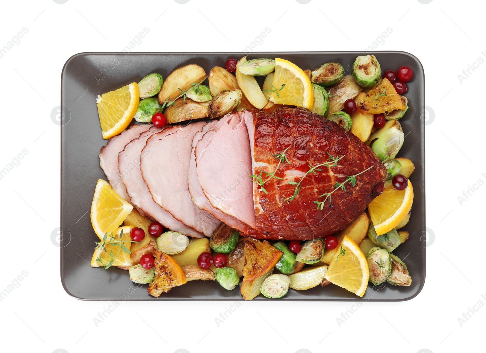 Photo of Tasty baked ham, vegetables and oranges isolated on white, top view