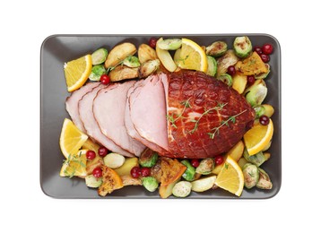 Tasty baked ham, vegetables and oranges isolated on white, top view