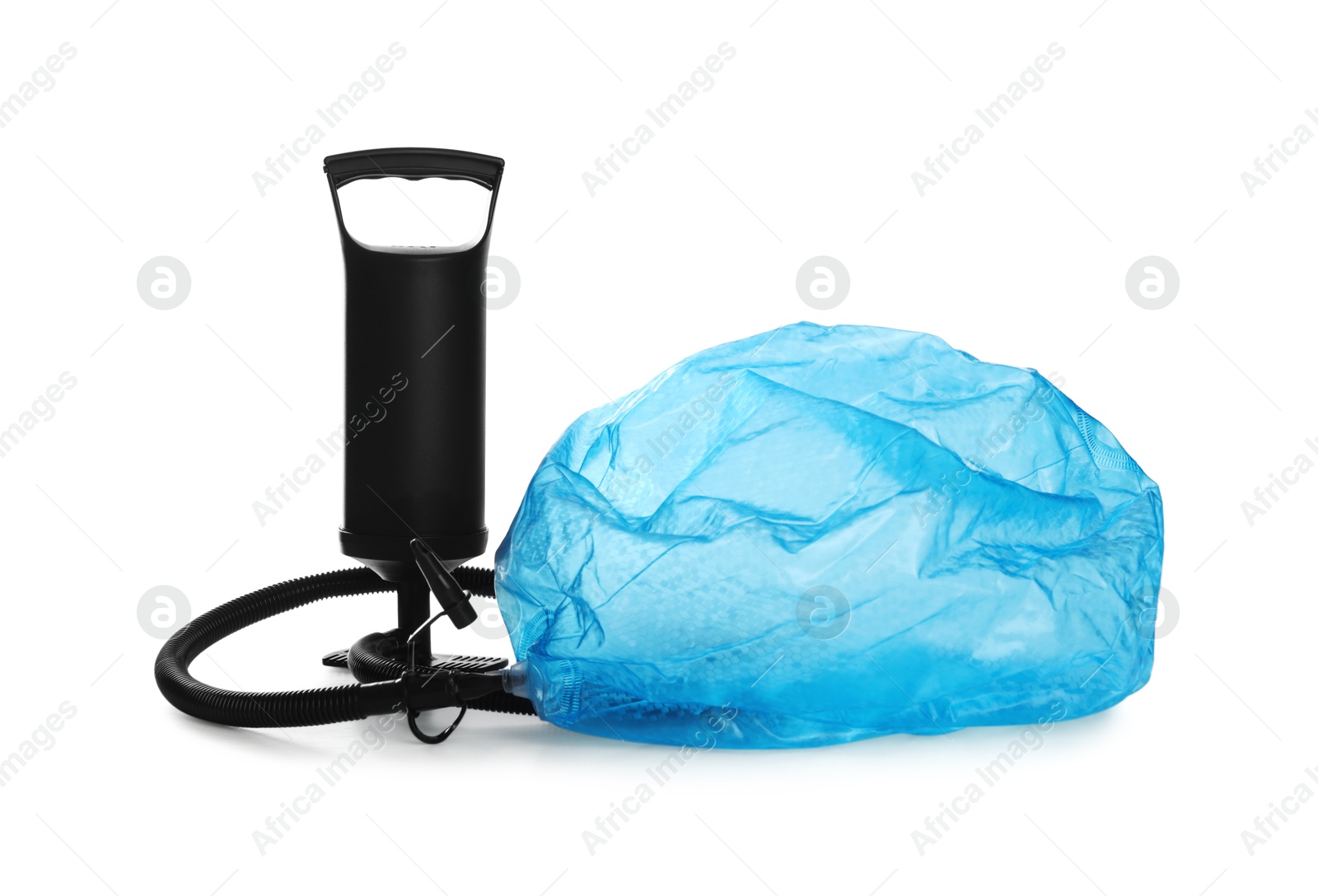 Photo of Deflated light blue beach ball and manual air pump isolated on white