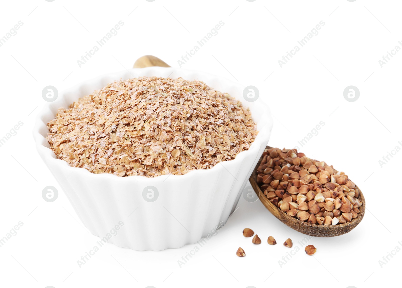 Photo of Buckwheat bran in bowl and grains isolated on white