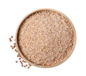 Photo of Buckwheat bran in wooden bowl and grains isolated on white, top view