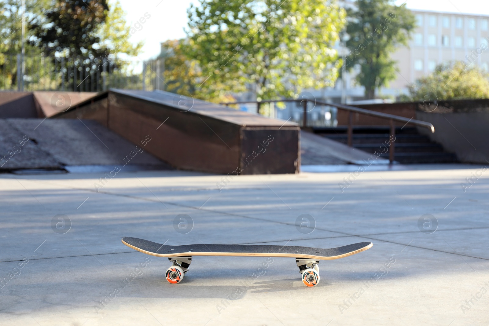 Photo of One modern skateboard with black griptape in skatepark