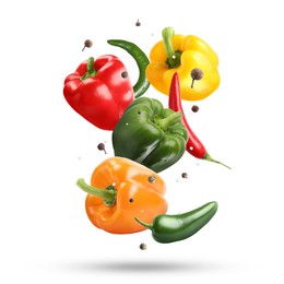 Image of Different fresh peppers and spices in air on white background