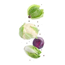 Image of Different fresh cabbages and spices in air on white background