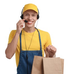 Photo of Fast-food worker with paper bags on white background