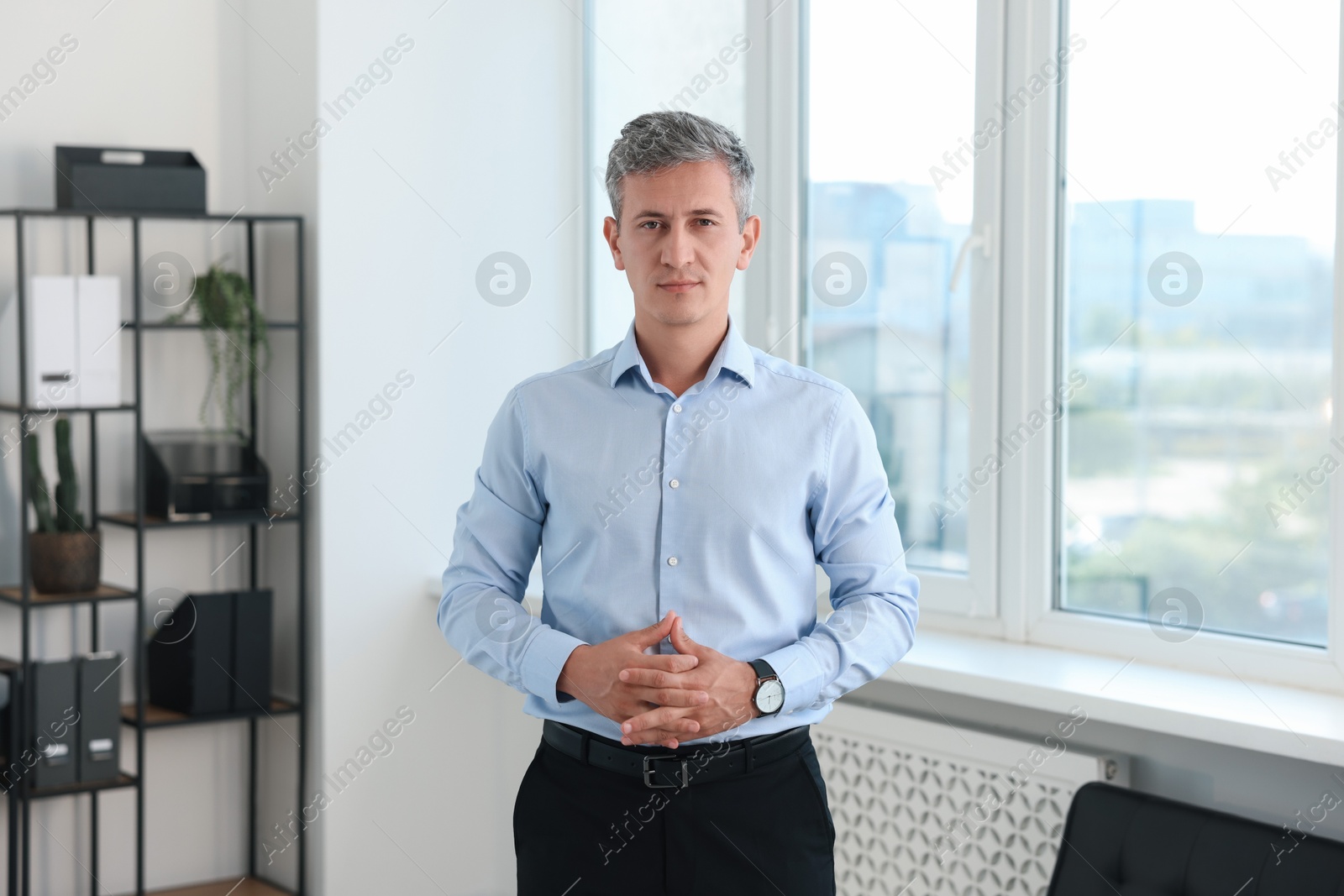 Photo of Portrait of middle aged man in office