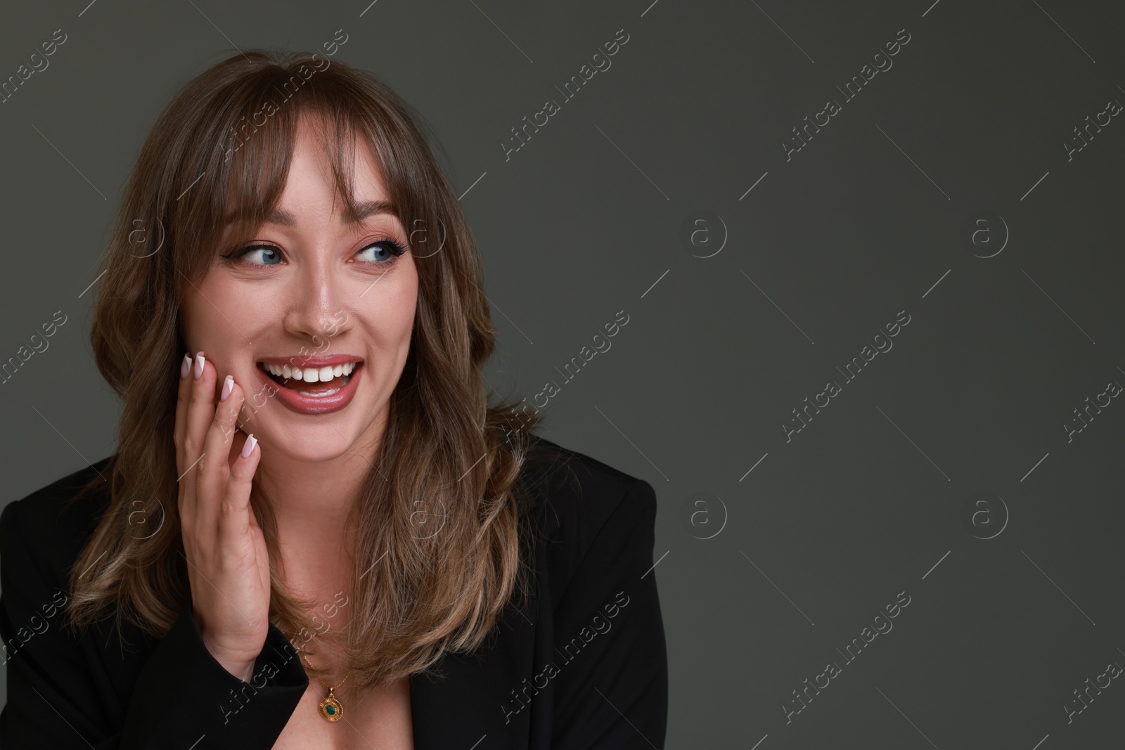 Photo of Attractive woman with stylish haircut on grey background, space for text