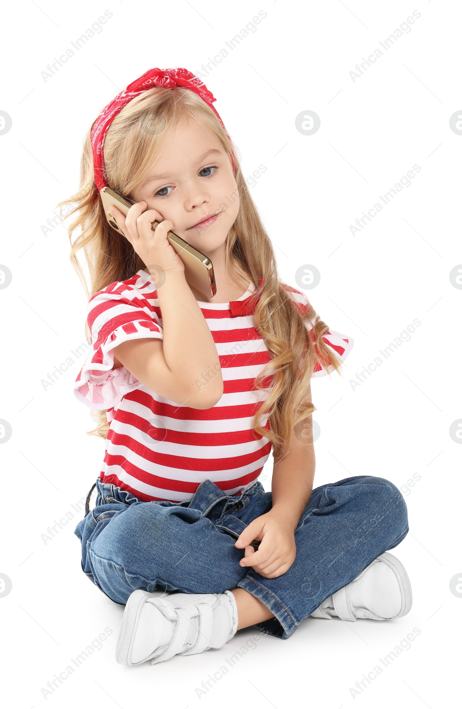 Photo of Cute little girl talking on smartphone against white background