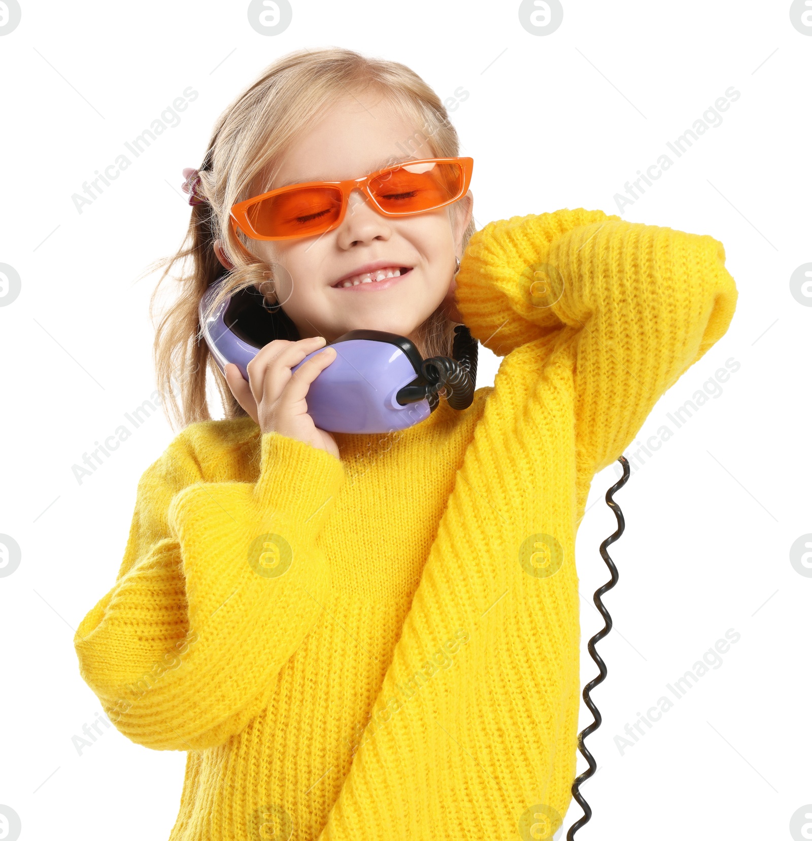 Photo of Cute little girl with handset of telephone on white background