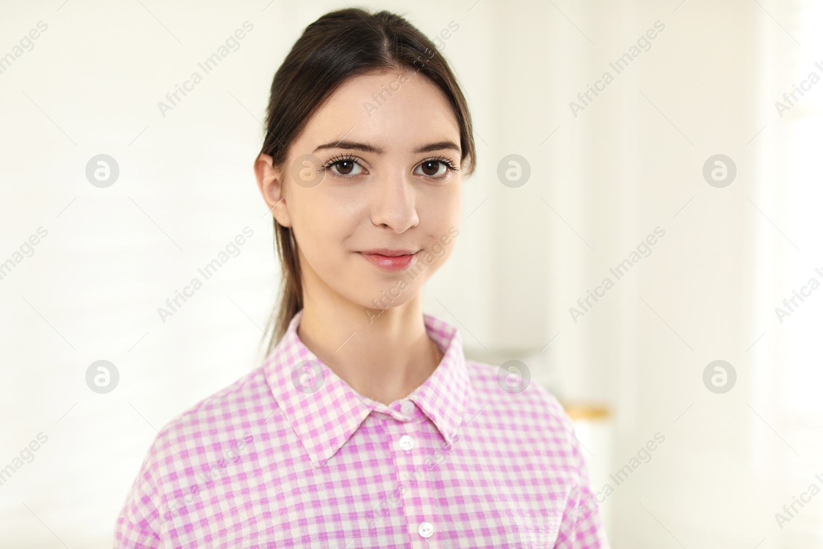 Photo of Portrait of beautiful teenage girl at home