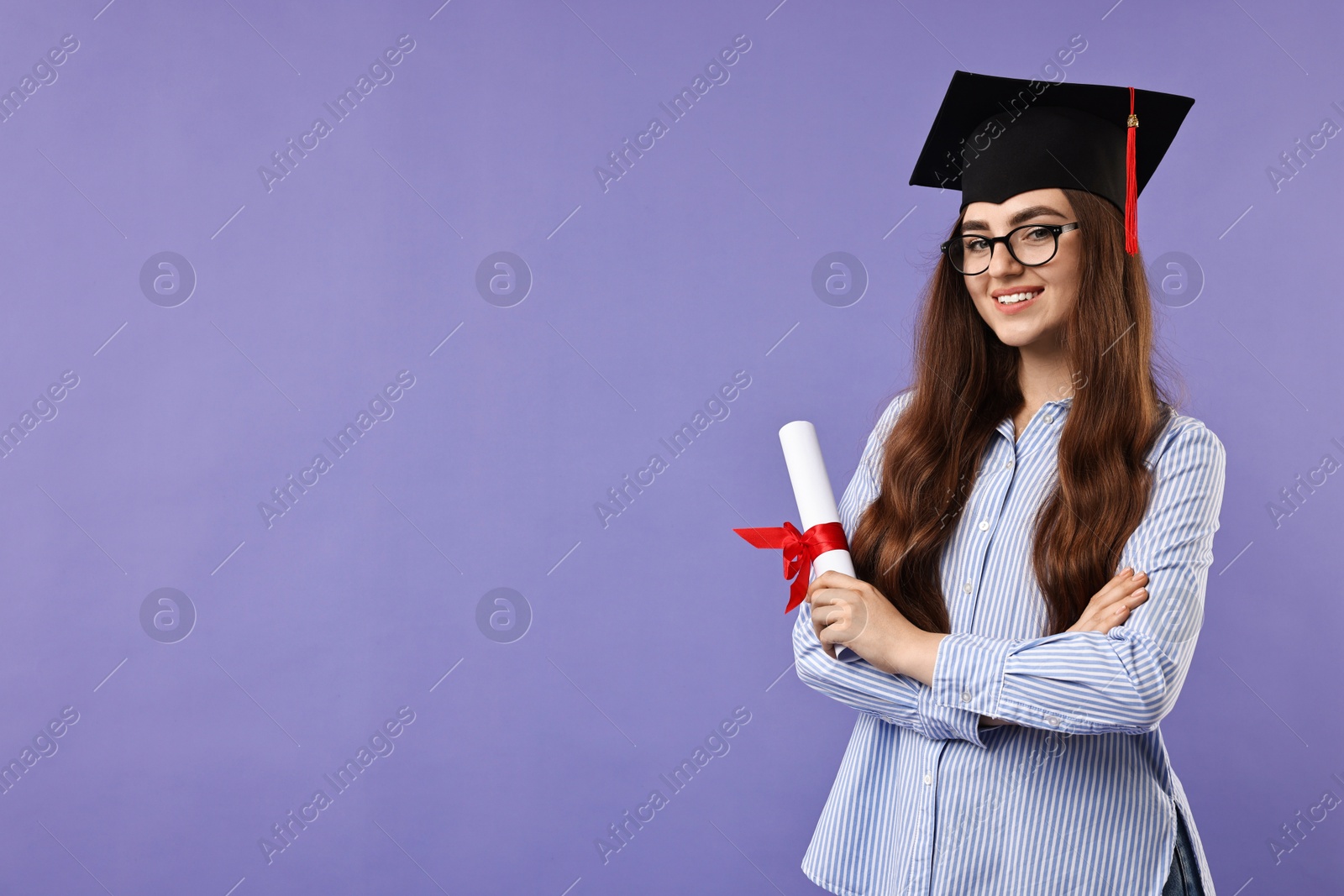 Photo of Happy student with diploma after graduation on violet background. Space for text