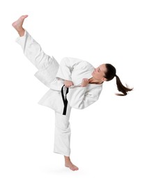 Photo of Young woman in kimono practicing karate on white background