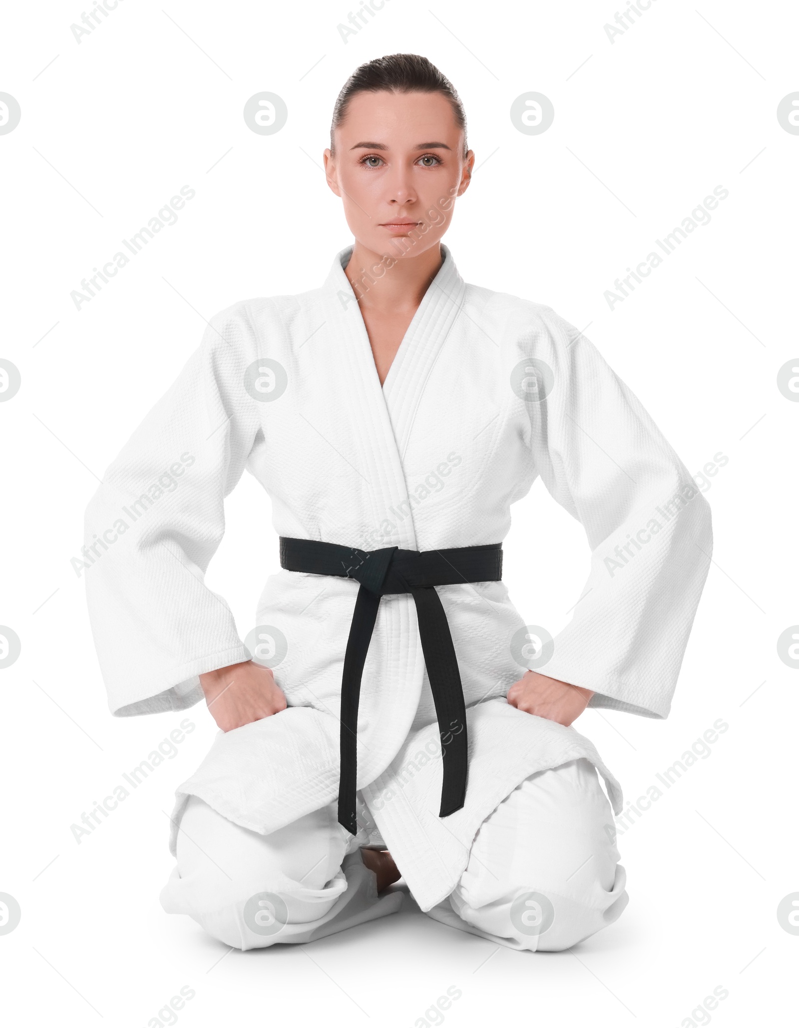 Photo of Karate fighter in kimono isolated on white