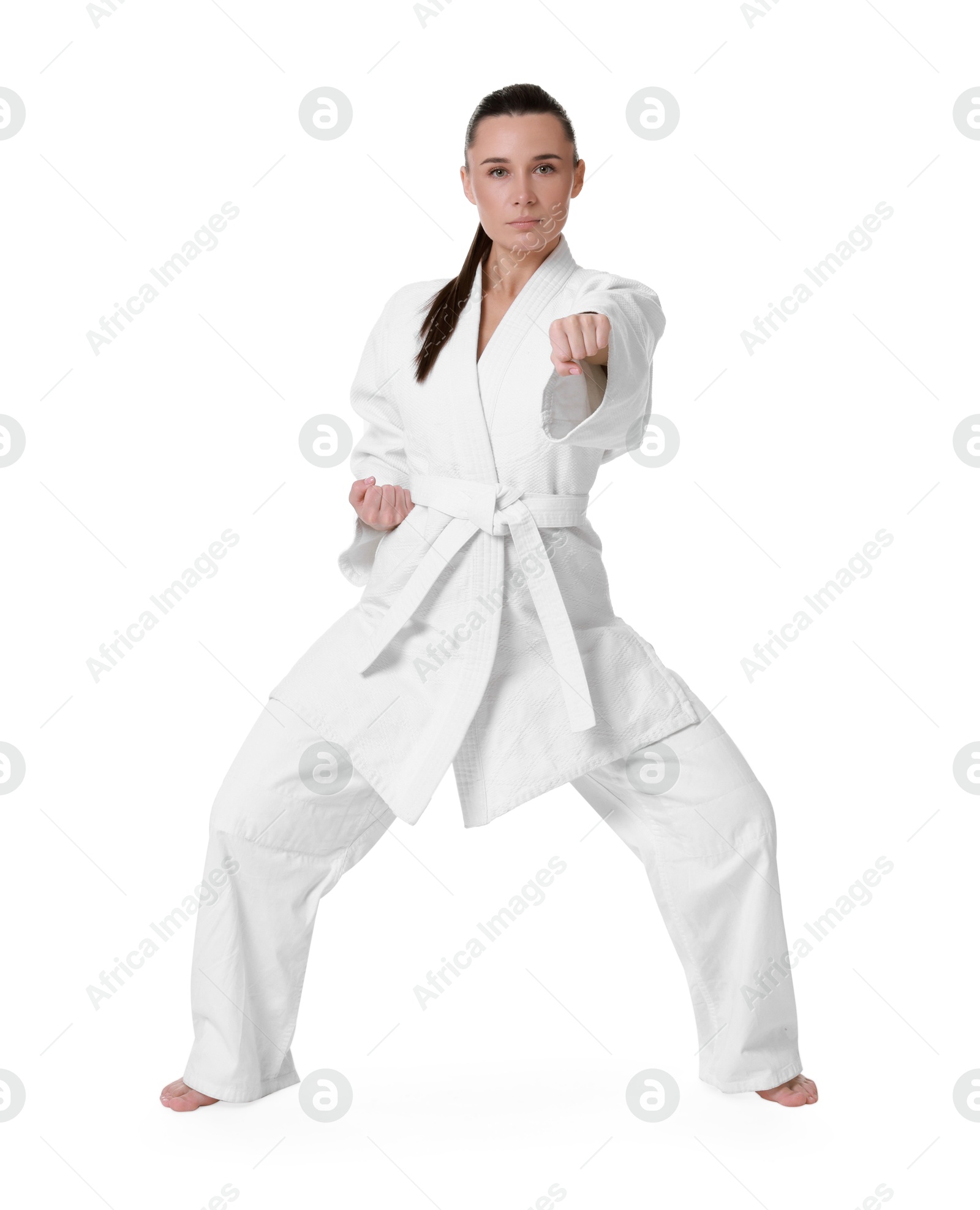 Photo of Karate fighter in kimono isolated on white