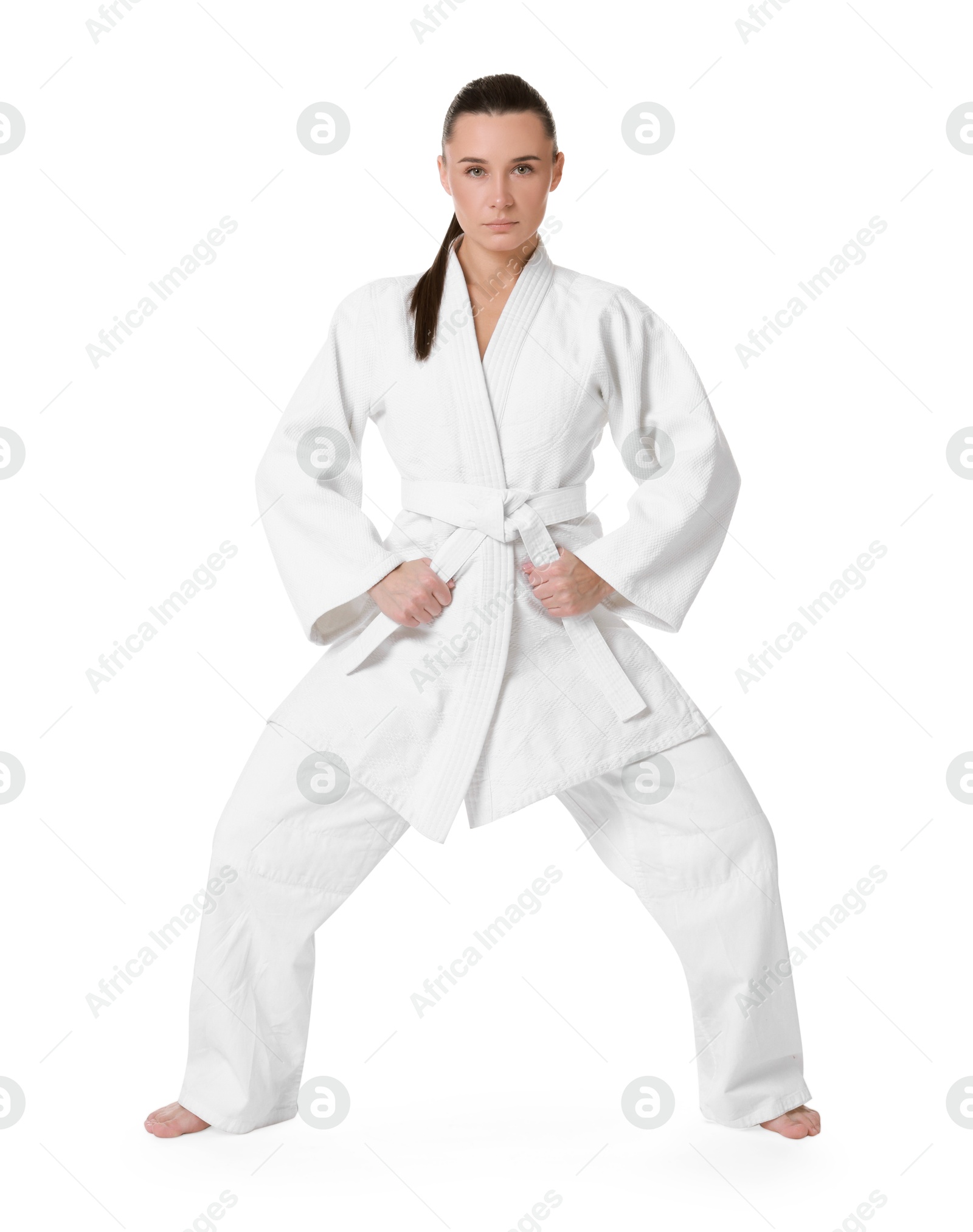 Photo of Karate fighter in kimono isolated on white