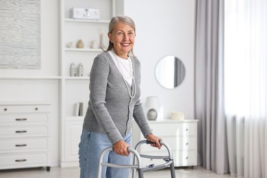 Photo of Senior woman with walking frame at home