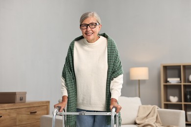 Photo of Senior woman with walking frame at home