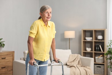 Photo of Senior woman with walking frame at home