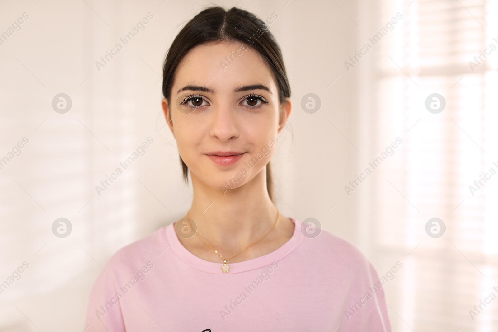 Photo of Portrait of beautiful teenage girl at home