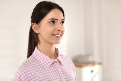 Photo of Portrait of beautiful teenage girl at home. Space for text