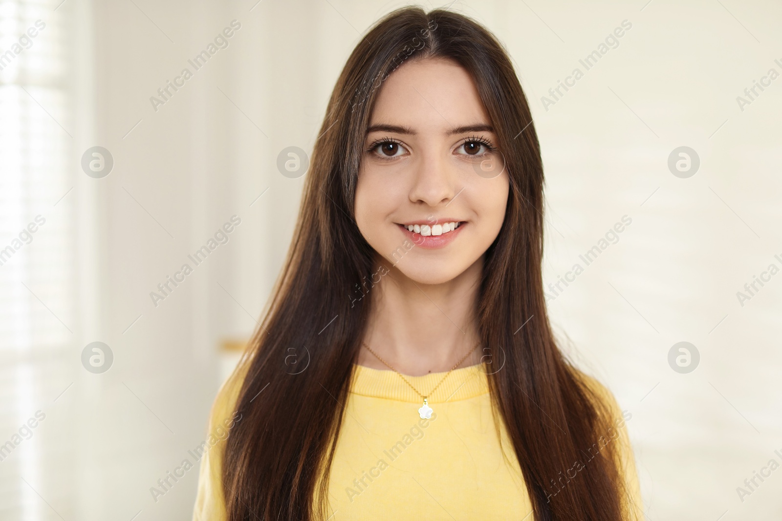 Photo of Portrait of happy teenage girl at home