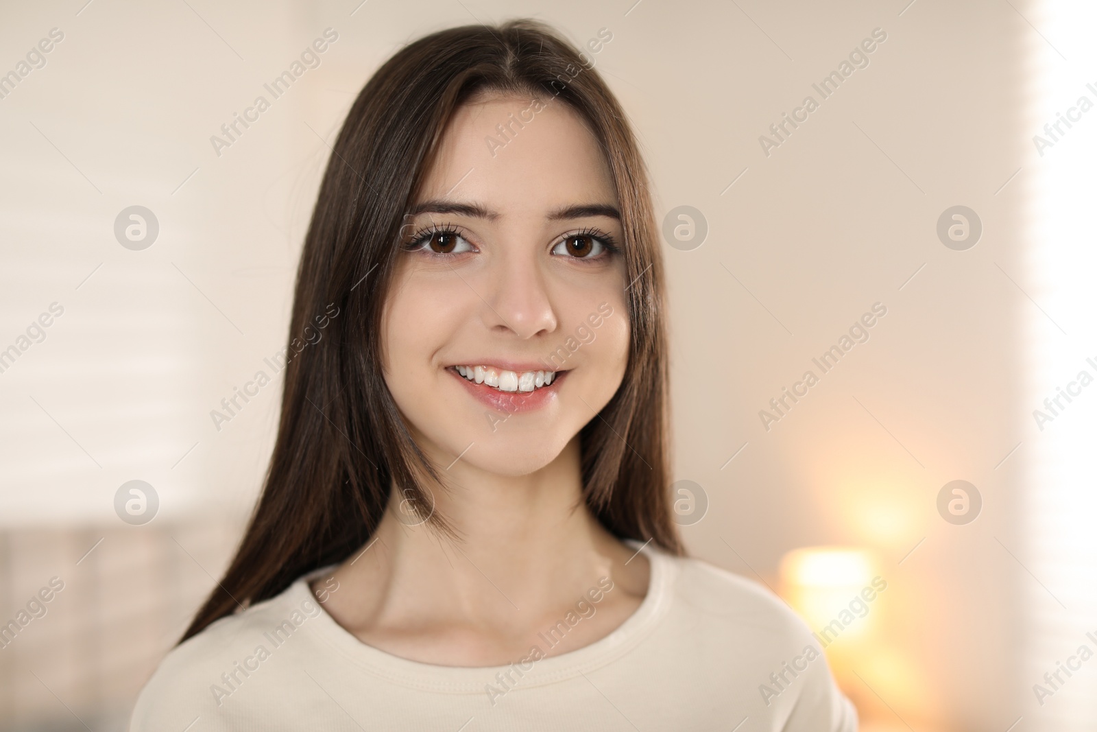 Photo of Portrait of happy teenage girl at home