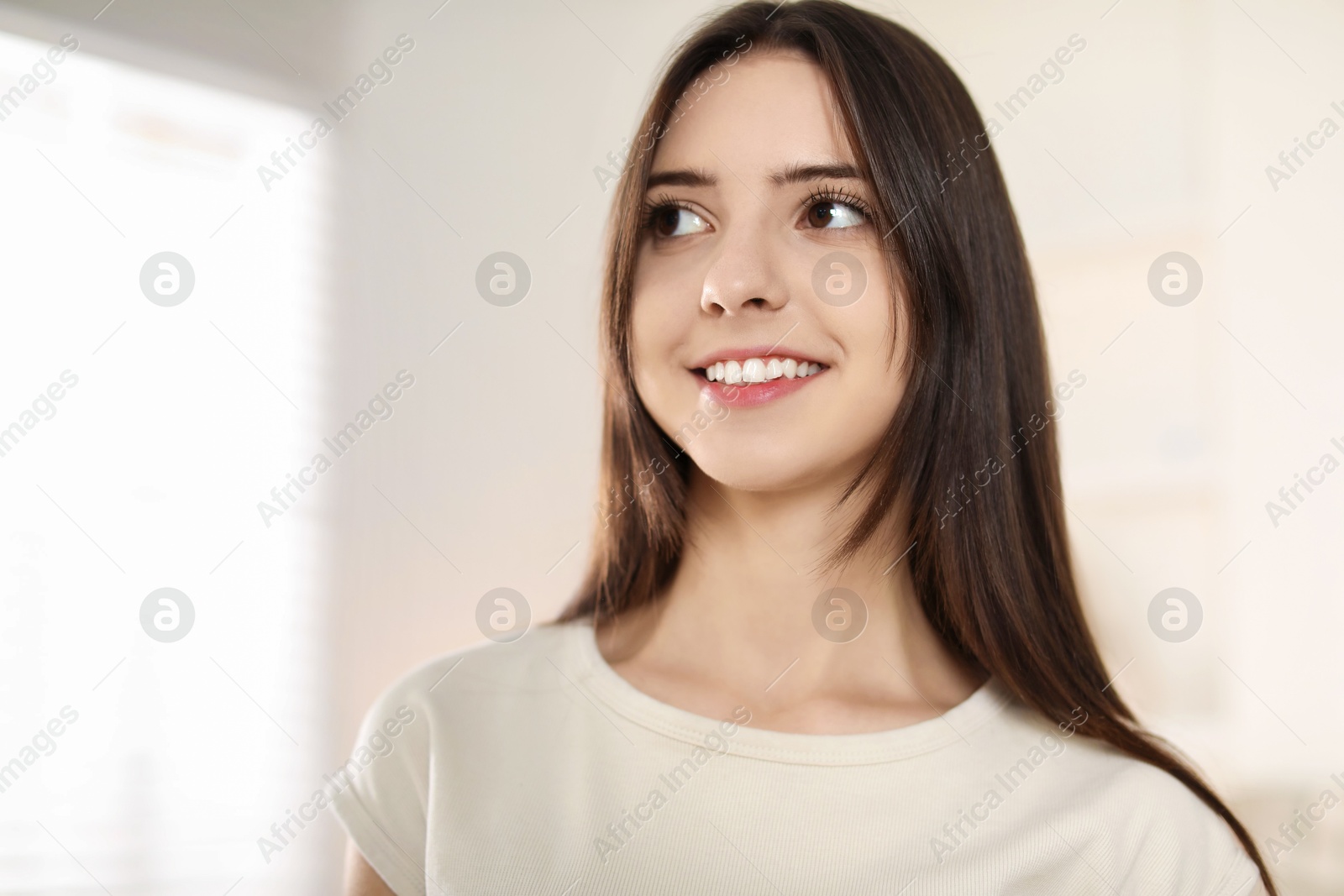 Photo of Portrait of happy teenage girl at home