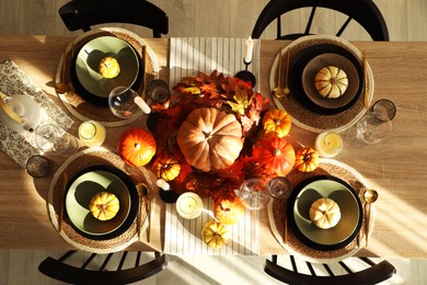 Stylish table setting with beautiful autumn decor in dining room, top view