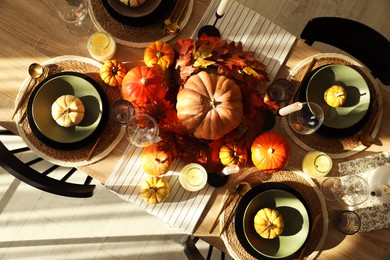 Photo of Stylish table setting with beautiful autumn decor in dining room, top view