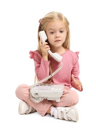 Photo of Cute little girl with telephone on white background