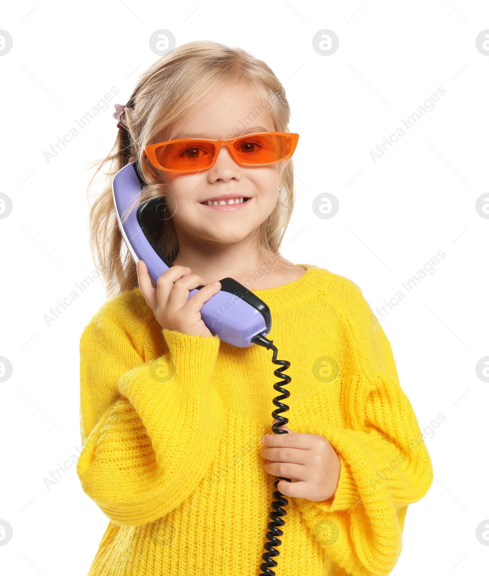 Photo of Cute little girl with handset of telephone on white background