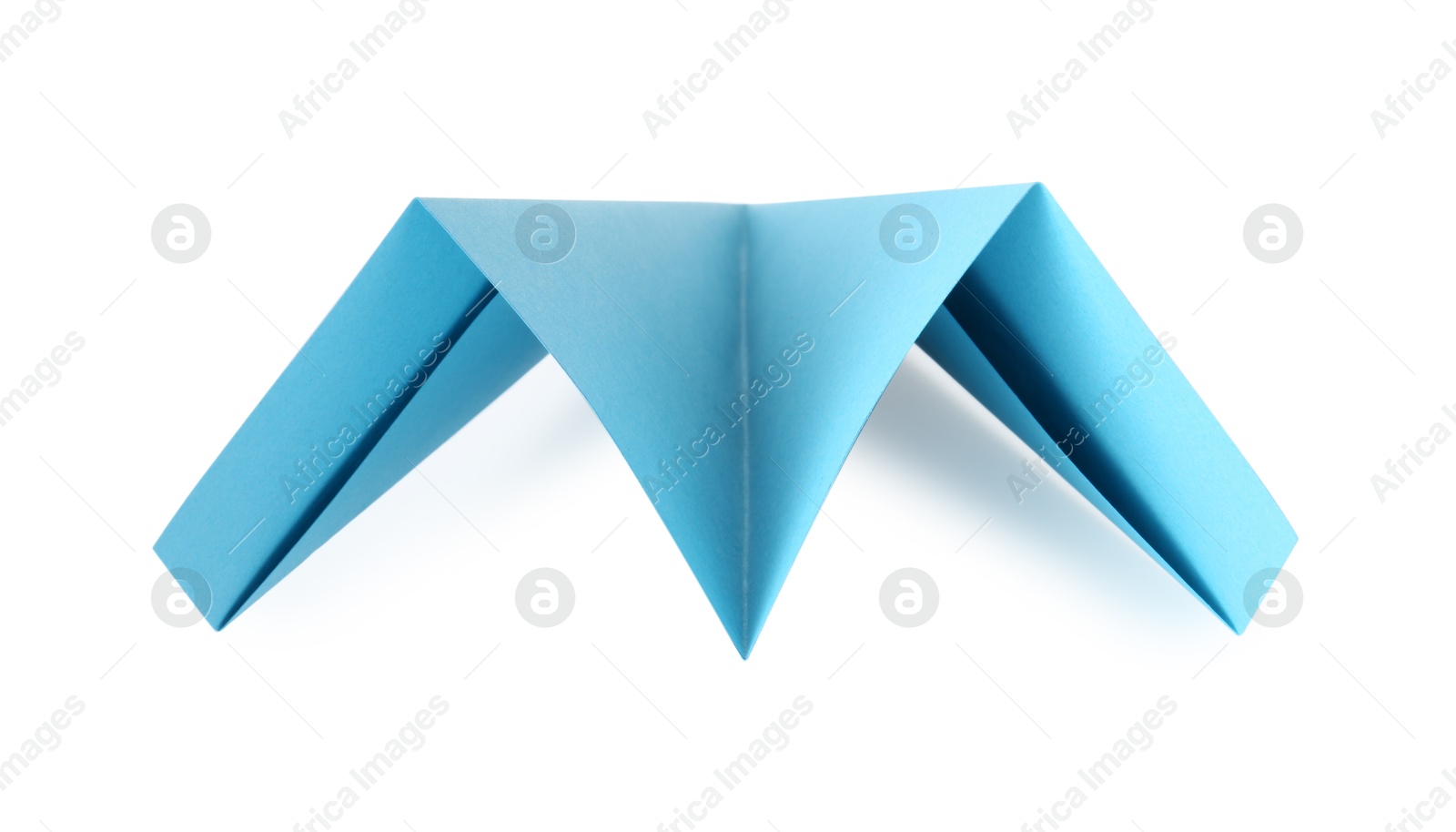 Photo of One handmade light blue paper plane isolated on white