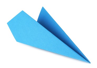 Photo of One handmade light blue paper plane isolated on white