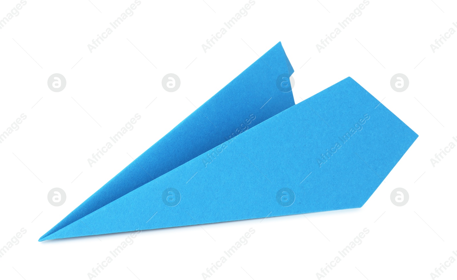 Photo of One handmade light blue paper plane isolated on white