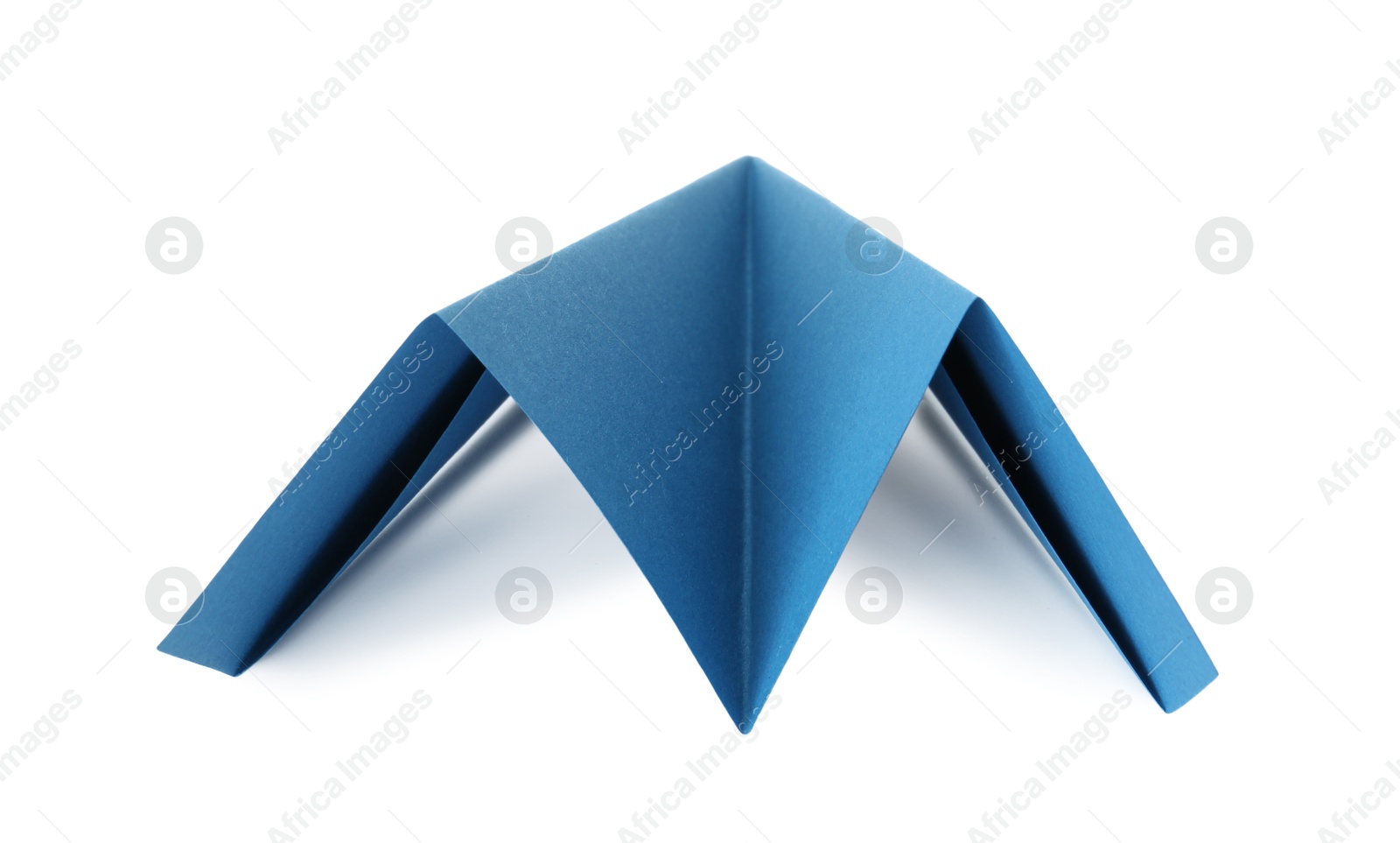 Photo of One handmade light blue paper plane isolated on white