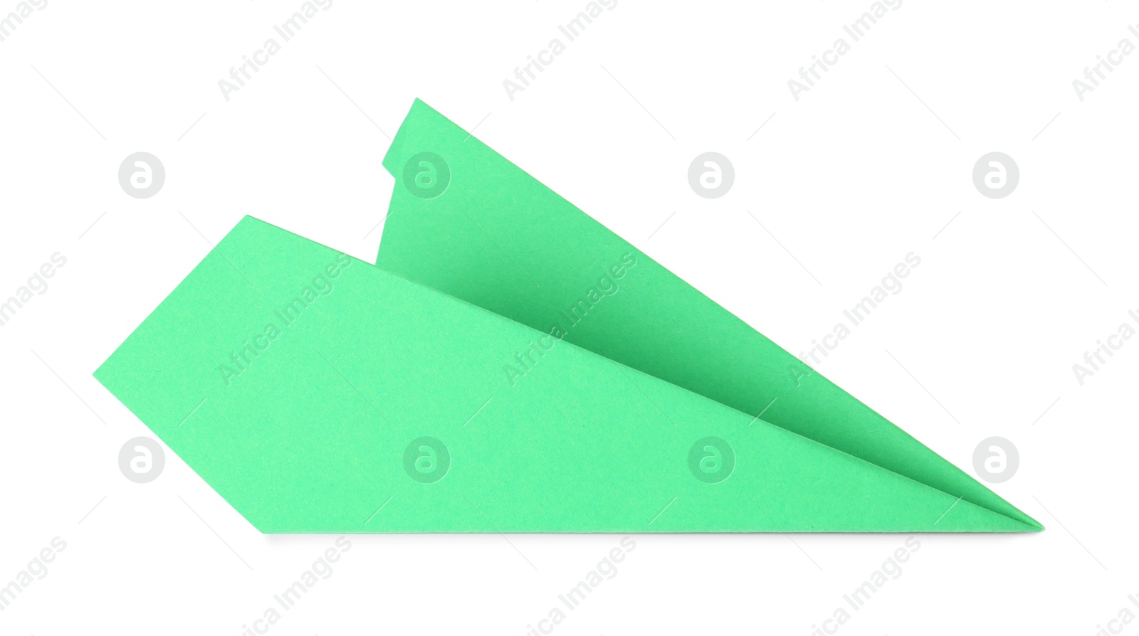 Photo of One handmade green paper plane isolated on white